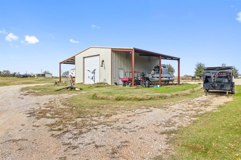 118 Dickey Road Sadler, TX 76264 - Photo 21 of 34 a view of a house with backyard and porch