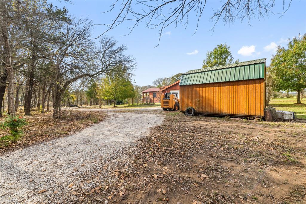 118 Dickey Road Sadler, TX 76264 - Photo 6 of 34 a view of backyard with wooden fence