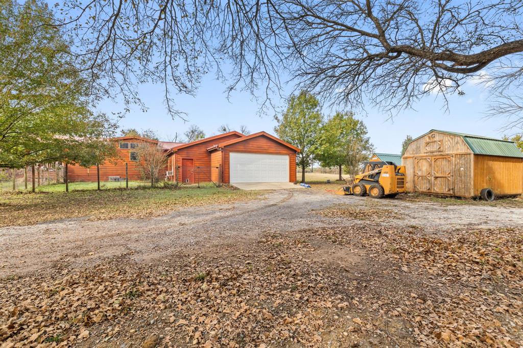 118 Dickey Road Sadler, TX 76264 - Photo 7 of 34 a view of house with backyard and tree