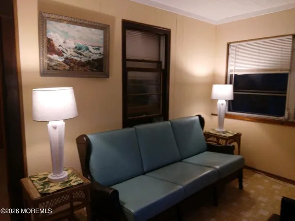 a bedroom with a bed and a mirror