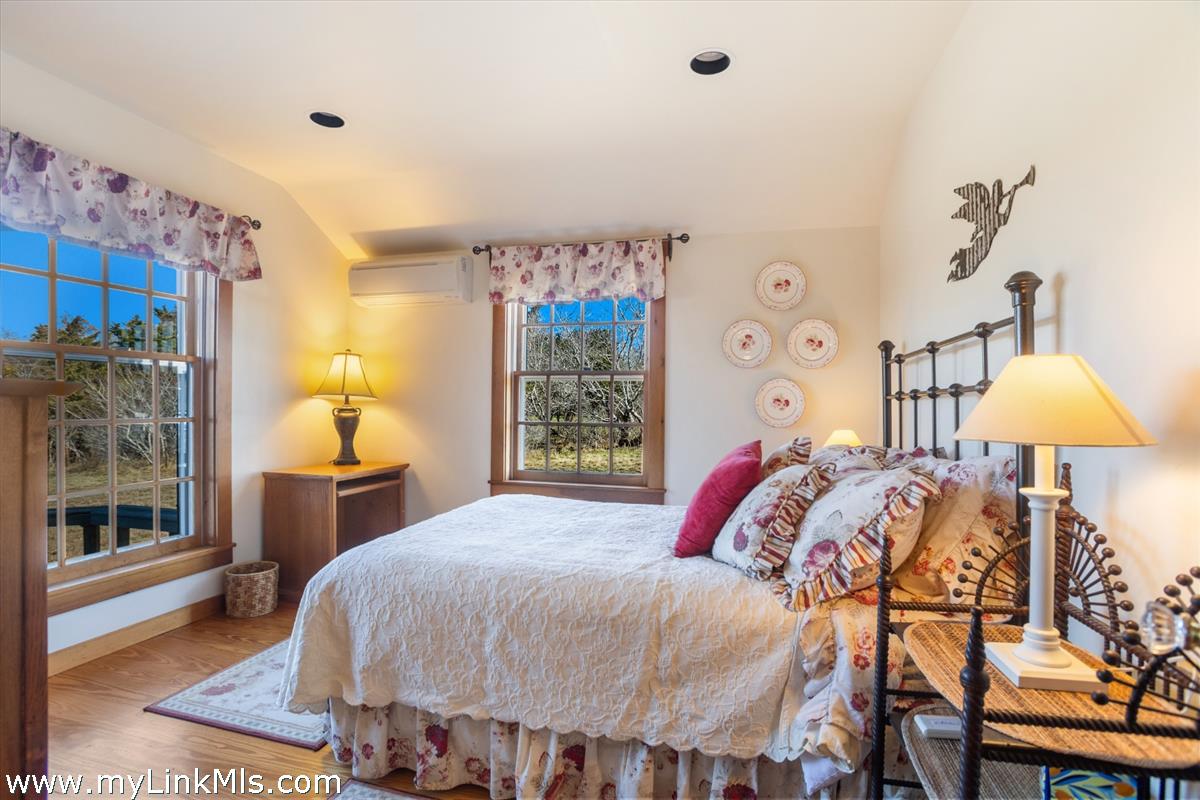 13 Eat Fire Spring Road Nantucket, MA 02554 - Photo 26 of 43 a bed sitting in a bedroom next to a window