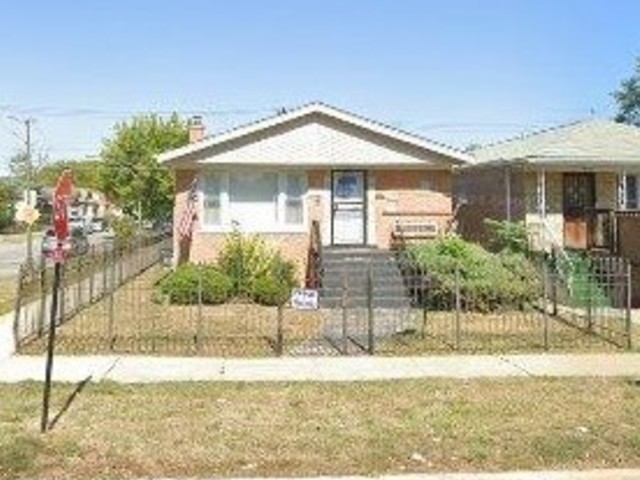422 West 107th Street Chicago, IL 60628 - Photo 1 of 1 a front view of a house with a yard