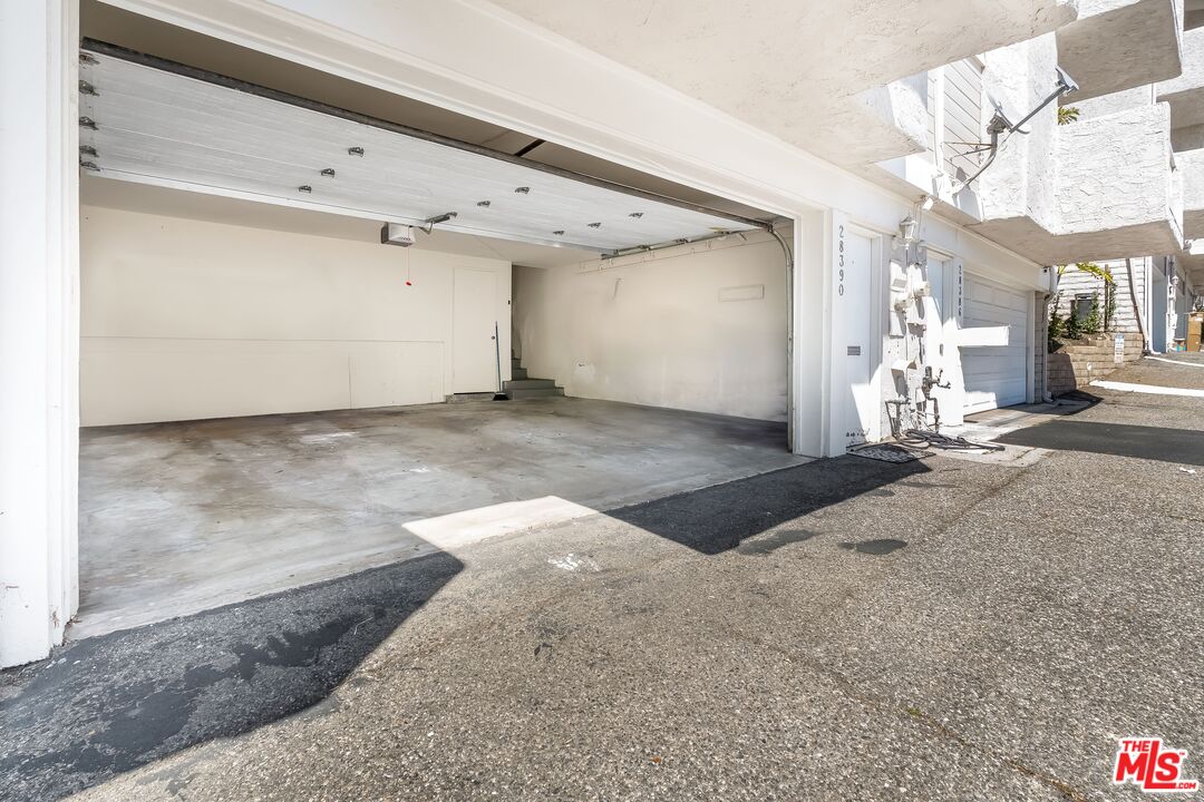 28390 Rey De Copas Lane Malibu, CA 90265 - Photo 16 of 18 a view of a large room with a large window