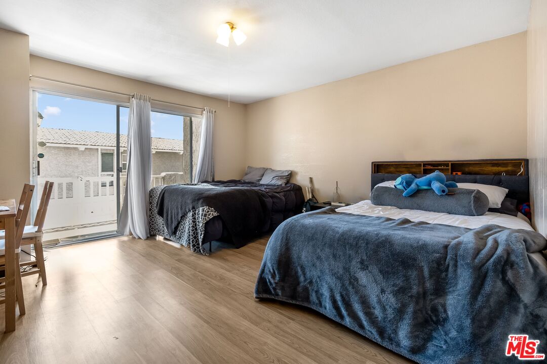28390 Rey De Copas Lane Malibu, CA 90265 - Photo 5 of 18 a bedroom with two beds and a large window