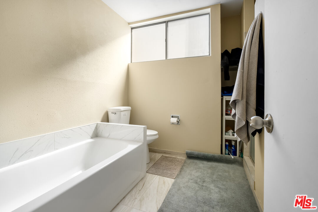28390 Rey De Copas Lane Malibu, CA 90265 - Photo 9 of 18 a bathroom with a bathtub