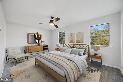 a bedroom with furniture and a window