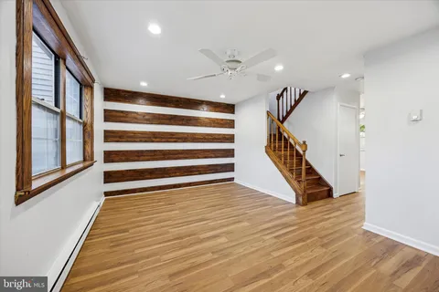 a view of an entryway with wooden floor