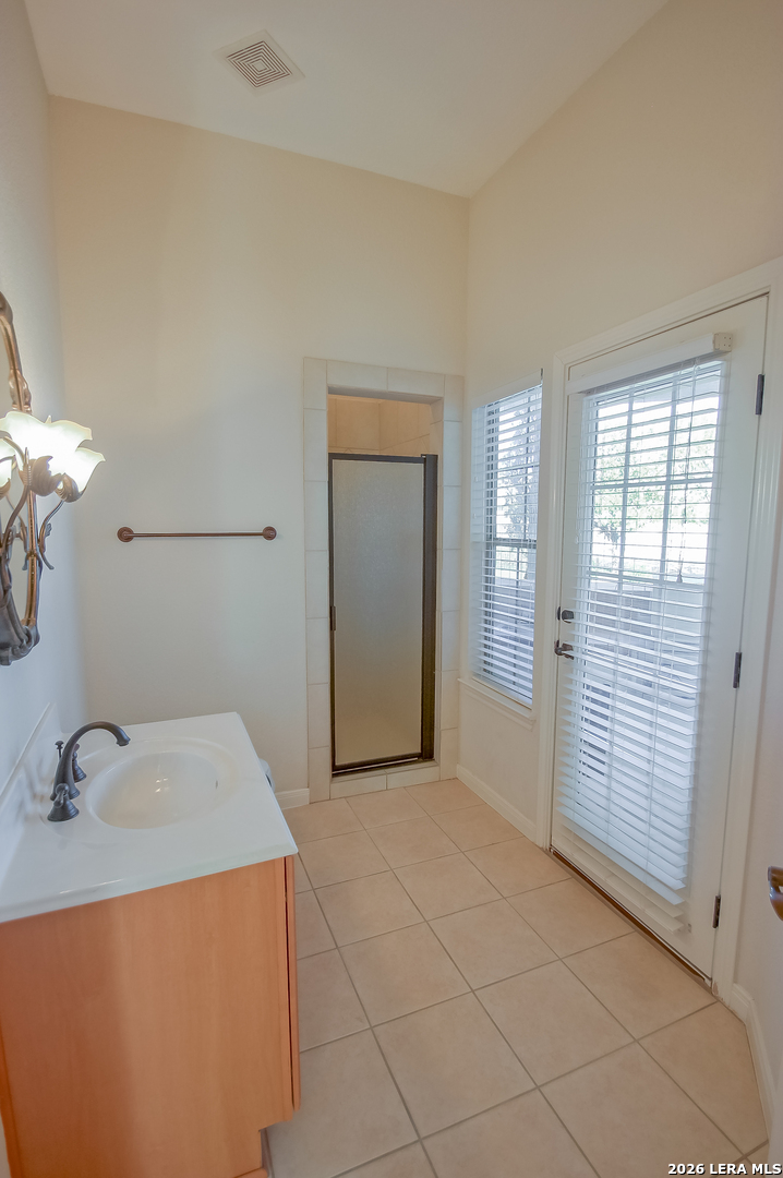 30901 Wood Bine Way Fair Oaks Ranch, TX 78015 - Photo 13 of 23 a view of a room that has a sink and a mirror