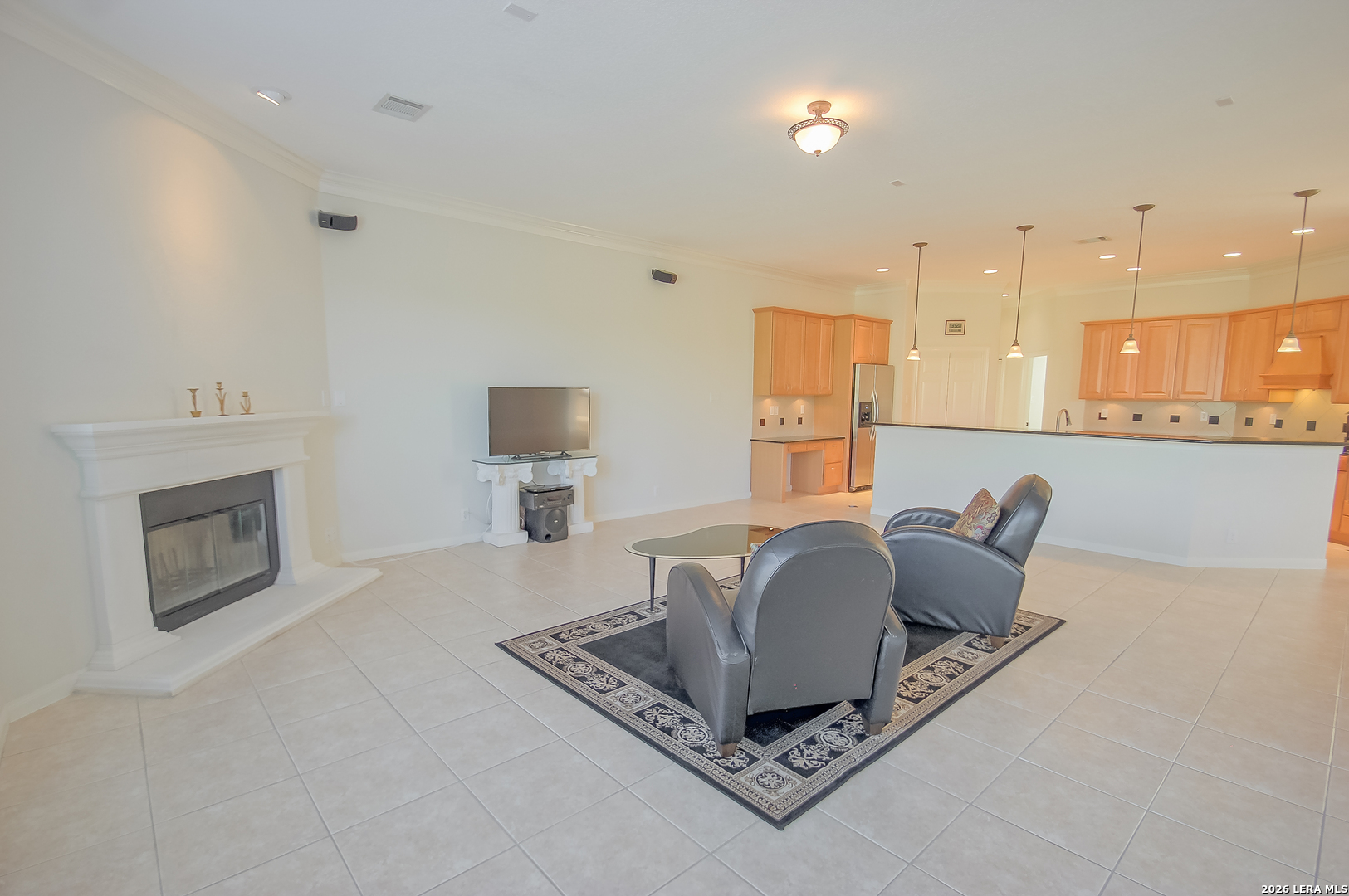 30901 Wood Bine Way Fair Oaks Ranch, TX 78015 - Photo 15 of 23 a living room with furniture and a fireplace