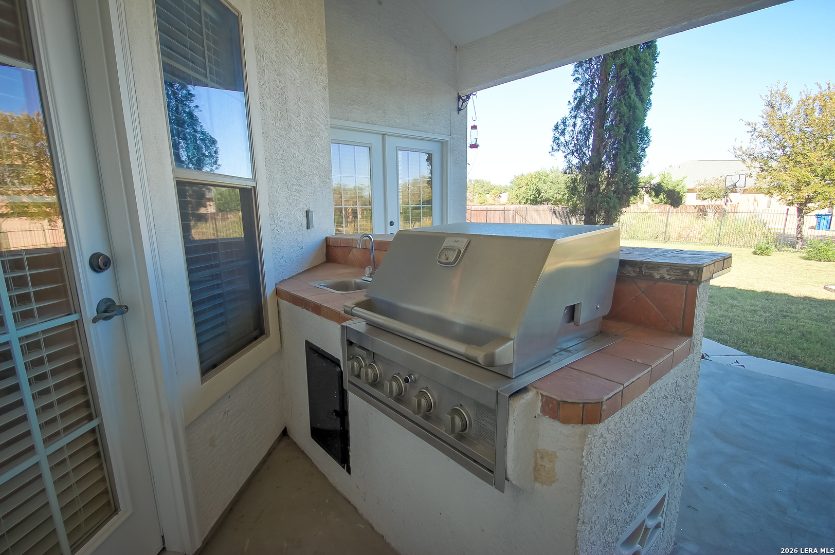 30901 Wood Bine Way Fair Oaks Ranch, TX 78015 - Photo 22 of 23 a view of washer and dryer with wooden floor