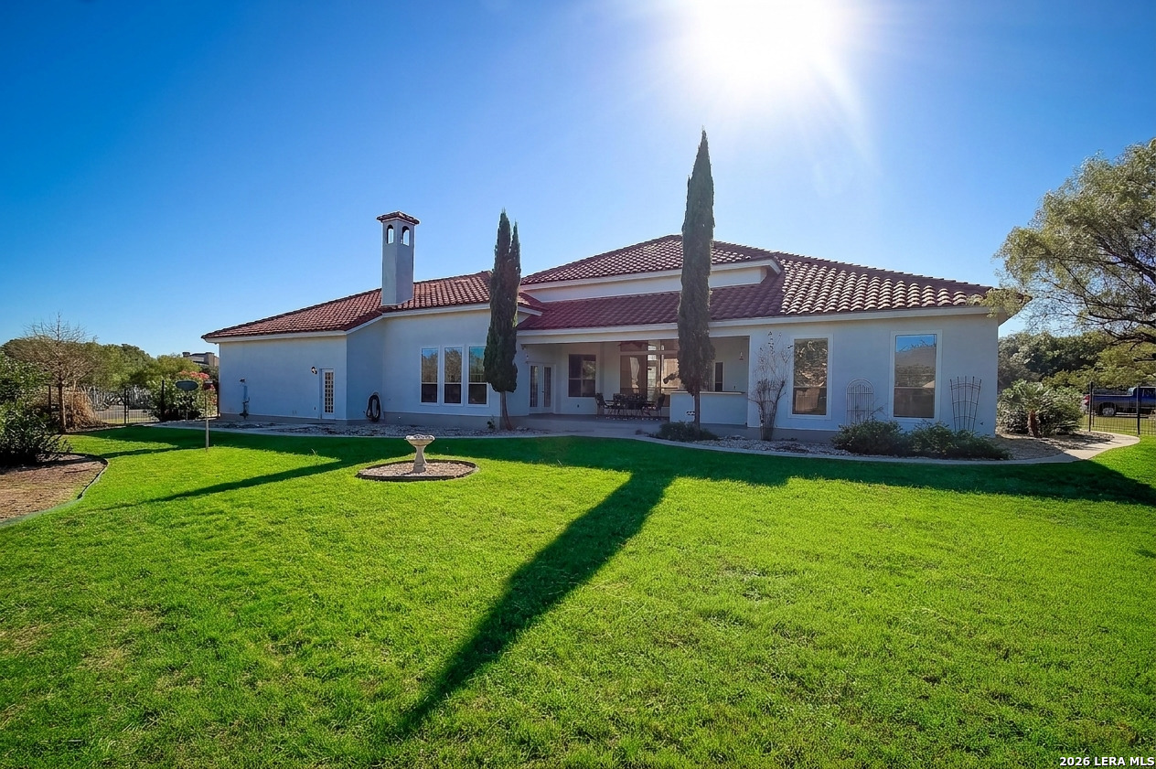 30901 Wood Bine Way Fair Oaks Ranch, TX 78015 - Photo 23 of 23 a front view of house with yard and green space
