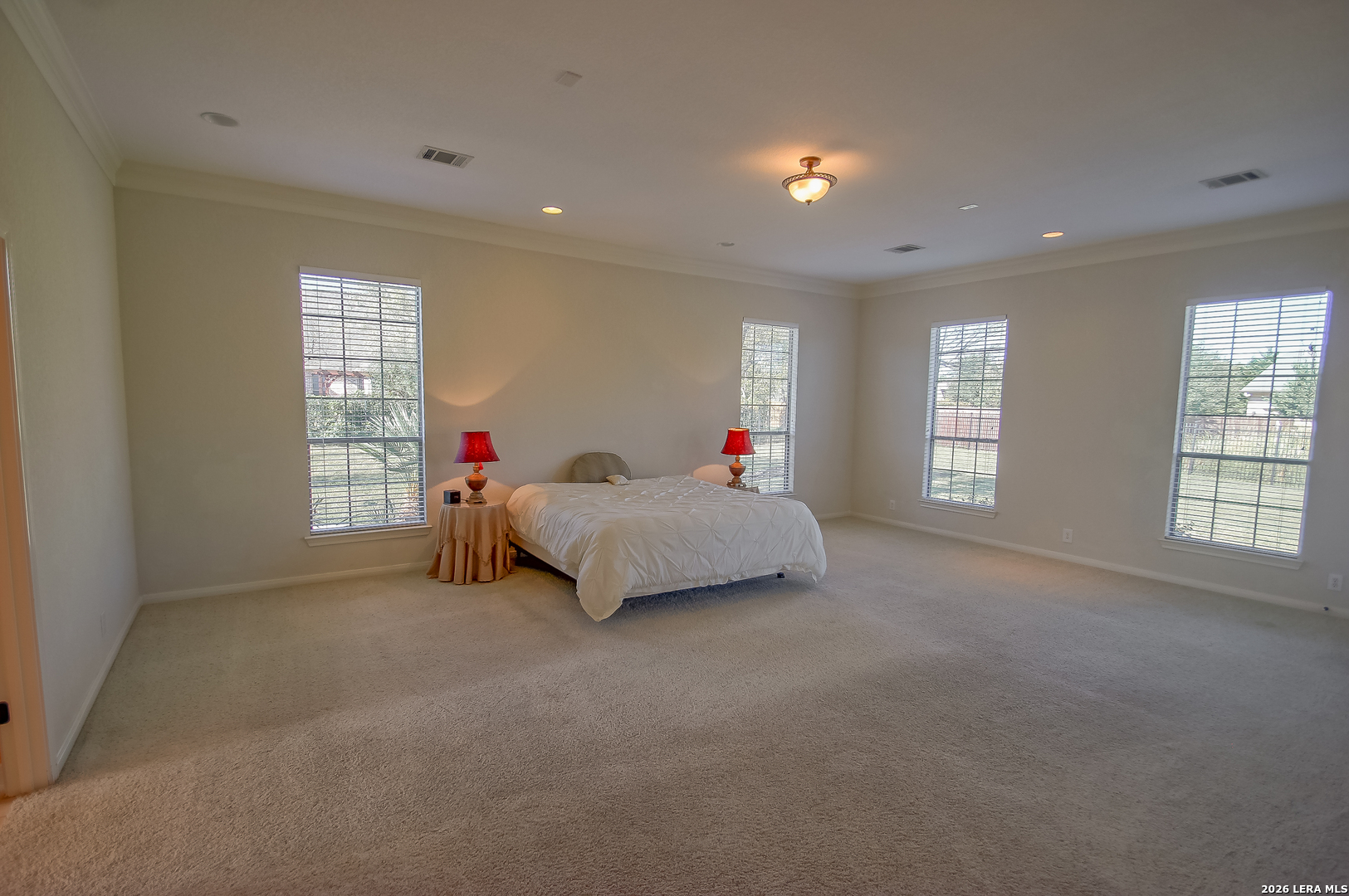 30901 Wood Bine Way Fair Oaks Ranch, TX 78015 - Photo 8 of 23 a bed room with a bed and a window