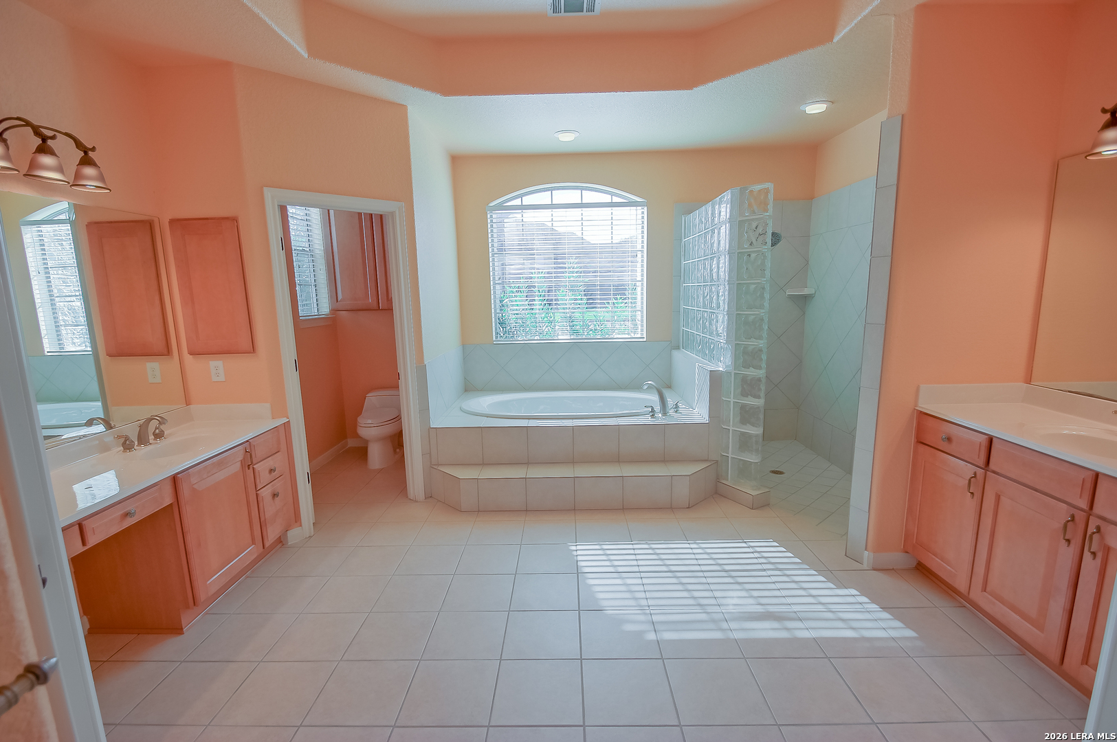 30901 Wood Bine Way Fair Oaks Ranch, TX 78015 - Photo 10 of 23 a bathroom with a tub sink and mirror