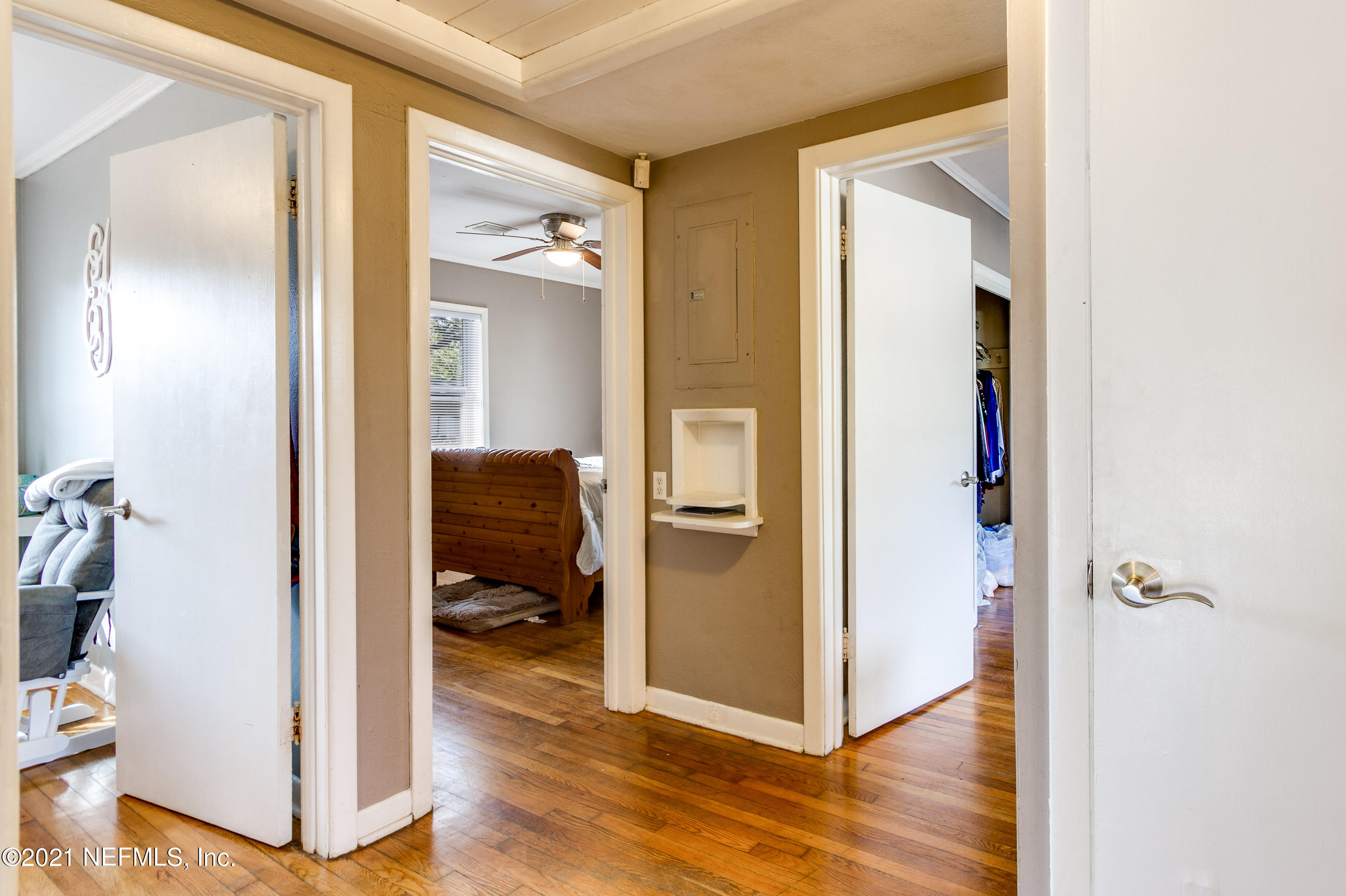 6044 Duke Road Jacksonville, FL 32217 - Photo 14 of 24 a view of a hallway with bathroom and wooden floor