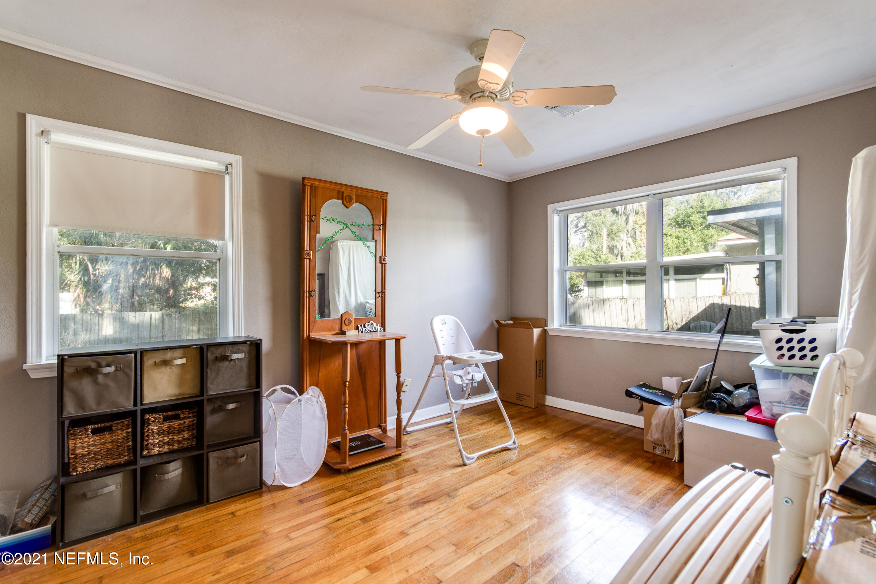 6044 Duke Road Jacksonville, FL 32217 - Photo 17 of 24 a living room with furniture a window and wooden floor