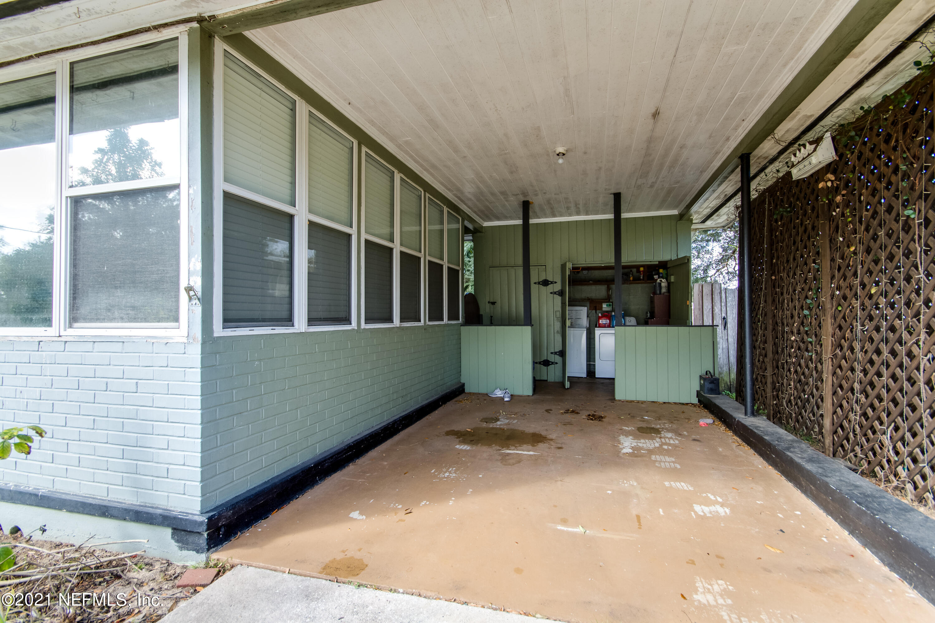 6044 Duke Road Jacksonville, FL 32217 - Photo 19 of 24 a view of a porch with a door