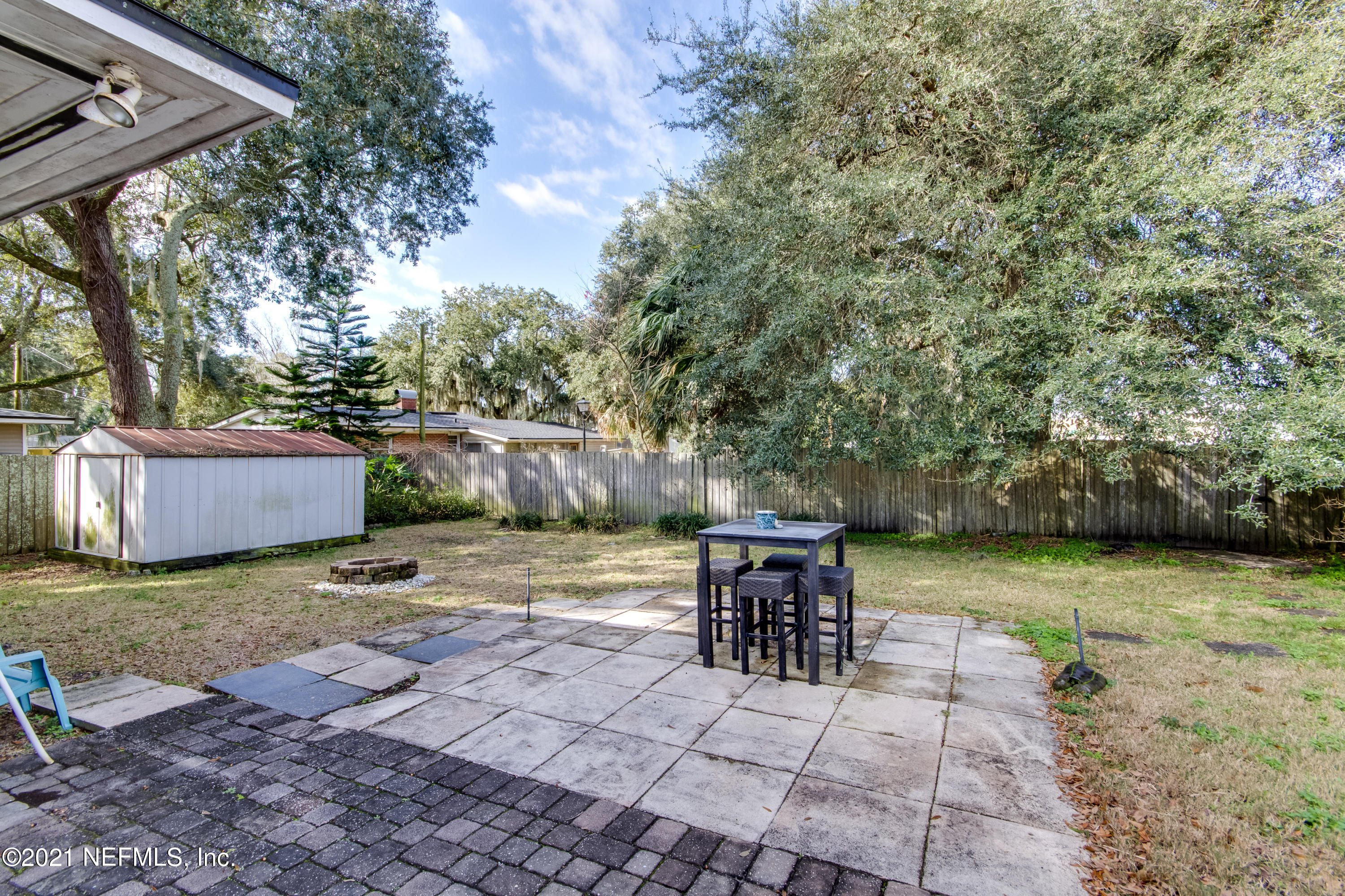 6044 Duke Road Jacksonville, FL 32217 - Photo 21 of 24 a view of a yard with furniture and a table