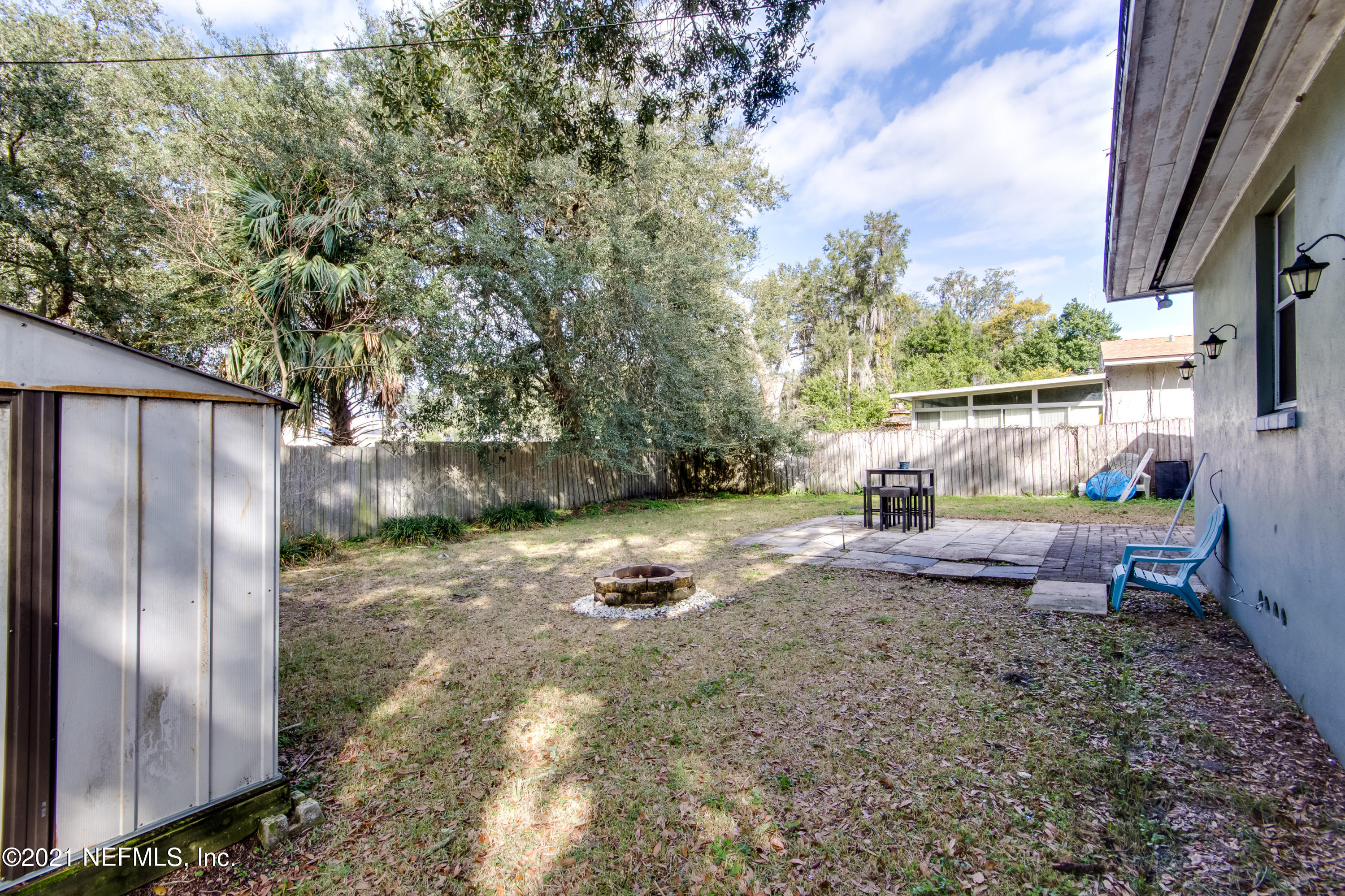 6044 Duke Road Jacksonville, FL 32217 - Photo 22 of 24 a backyard of a house with table and chairs