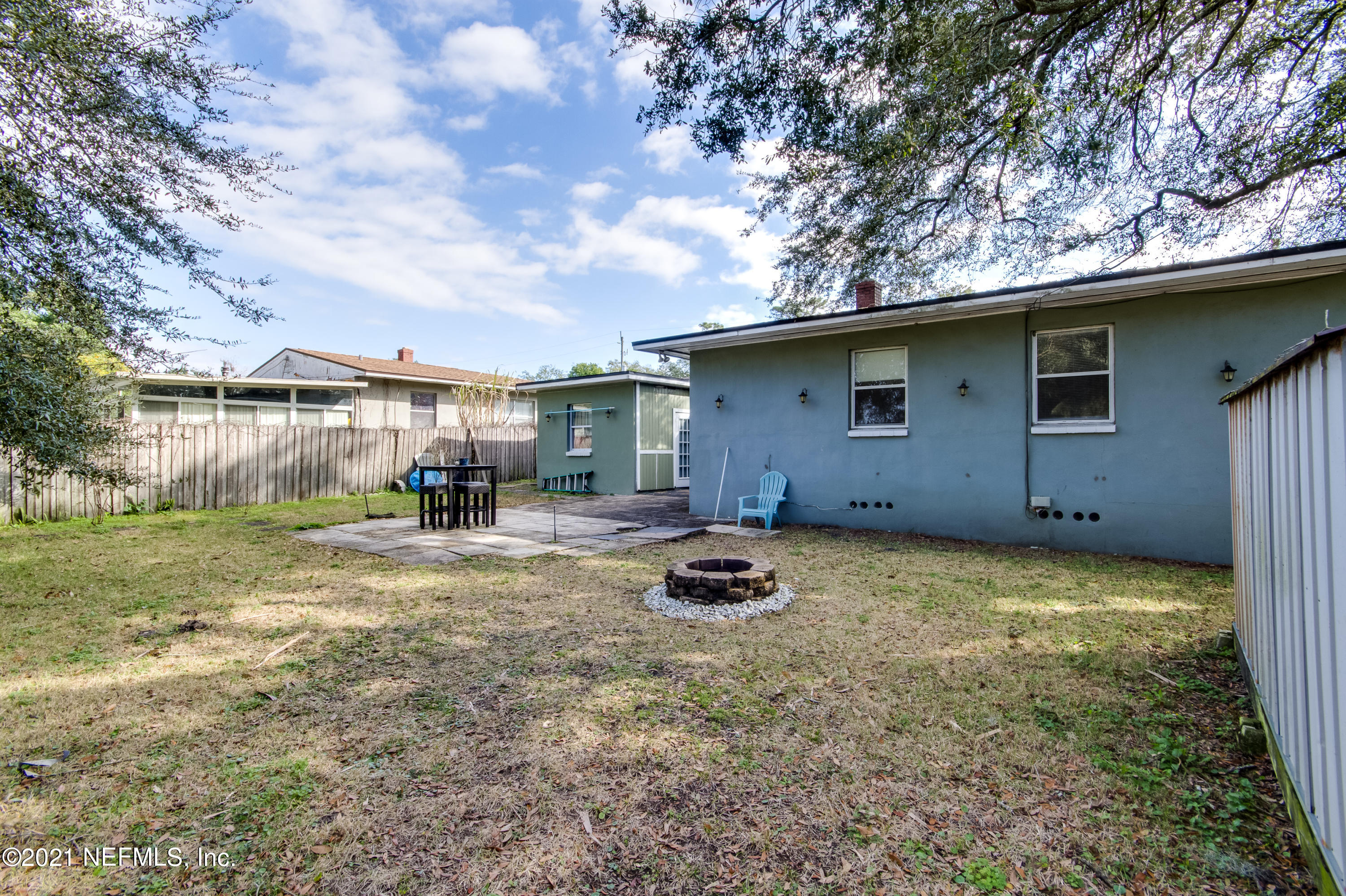 6044 Duke Road Jacksonville, FL 32217 - Photo 23 of 24 a backyard of a house with table and chairs