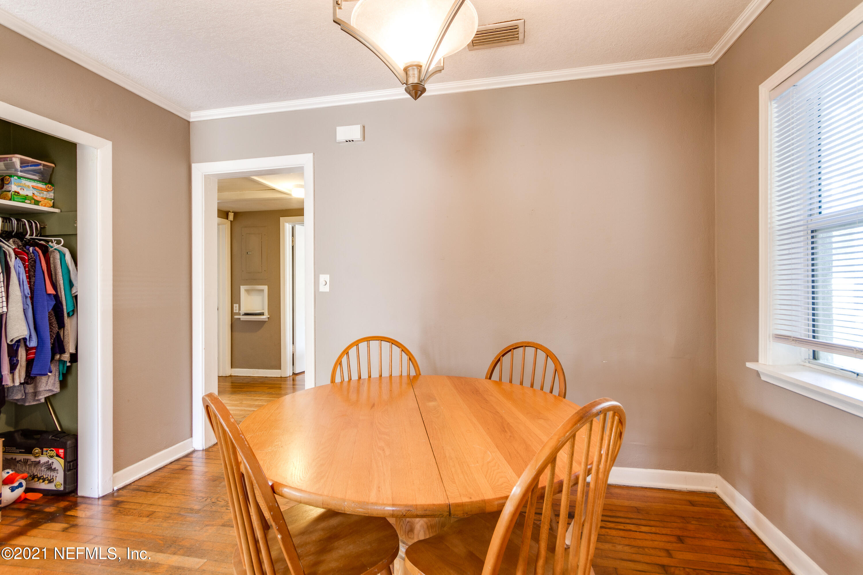 6044 Duke Road Jacksonville, FL 32217 - Photo 9 of 24 a view of a dining room with furniture and a window