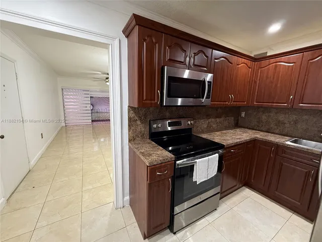 a kitchen with a stove and a microwave