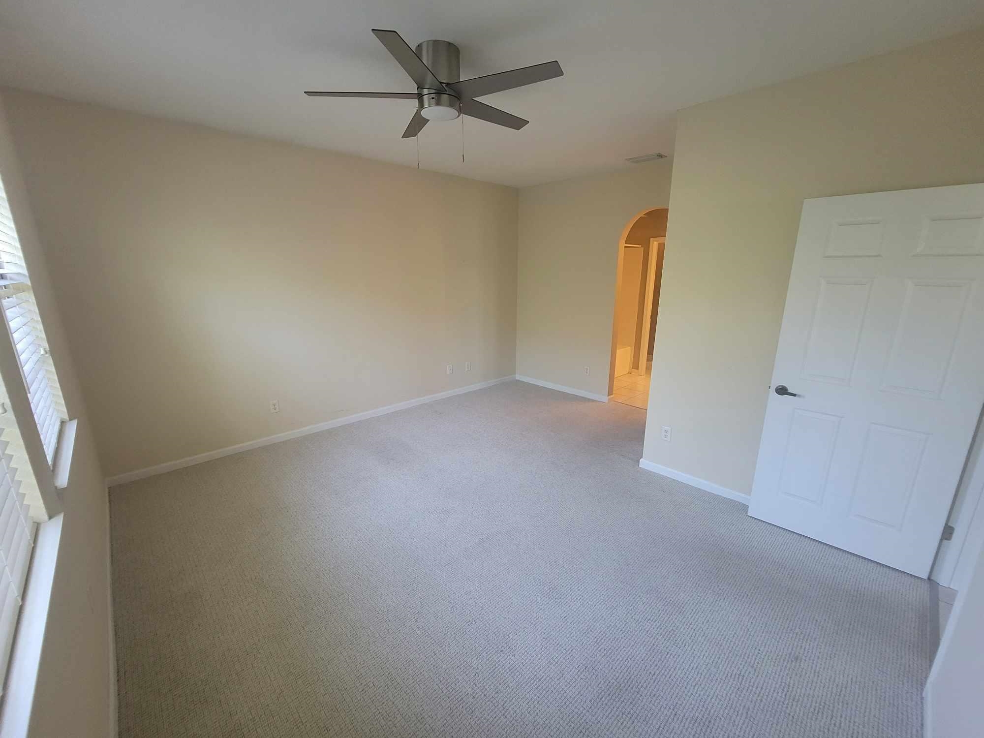 2431 Vista Cove Road St. Augustine, FL 32084 - Photo 14 of 33 an empty room with a empty space and a ceiling fan