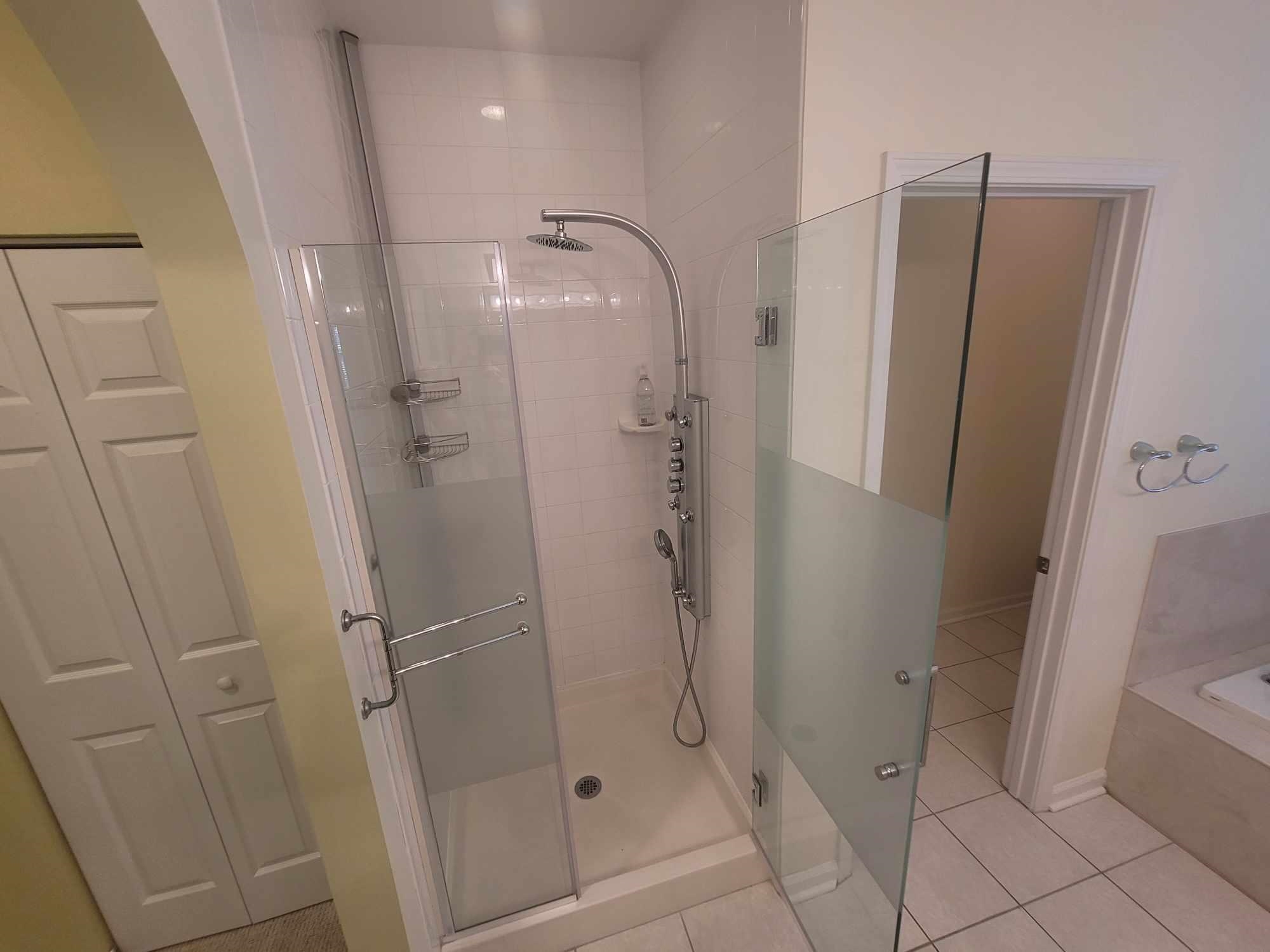 2431 Vista Cove Road St. Augustine, FL 32084 - Photo 21 of 33 a bathroom with a glass shower door and a sink