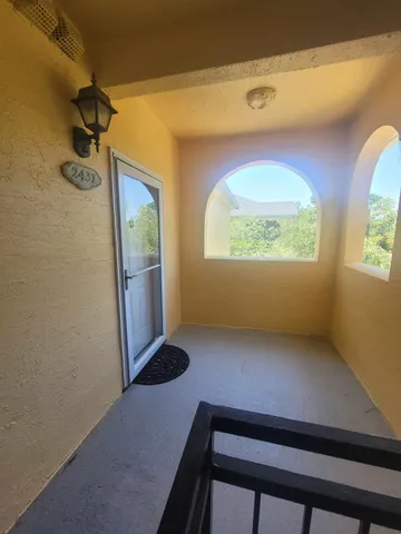 a view of an empty room and a window