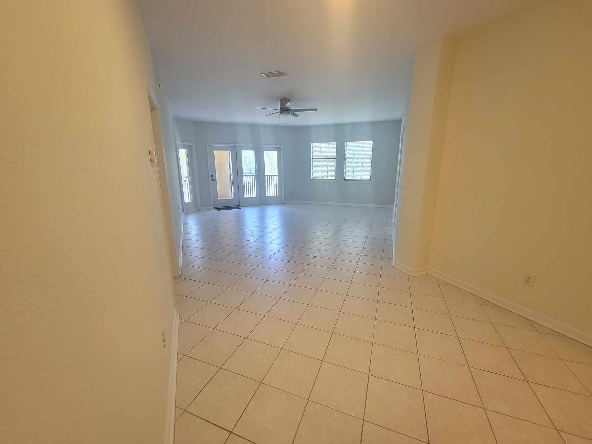 2431 Vista Cove Road St. Augustine, FL 32084 - Photo 8 of 33 wooden floor in an empty room with a window