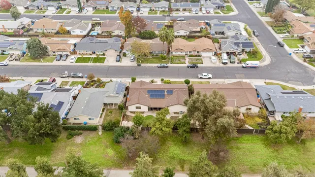 an aerial view of residential houses with outdoor space