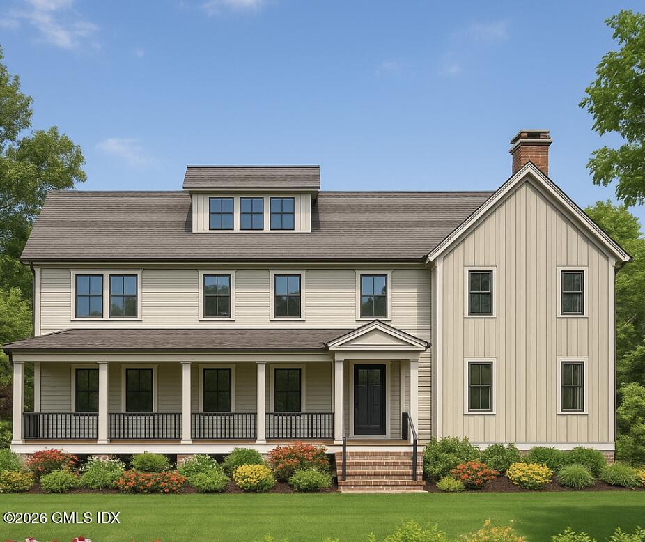 9 Walnut Street Cos Cob, CT 06807 - Photo 4 of 7 a front view of a house with a yard