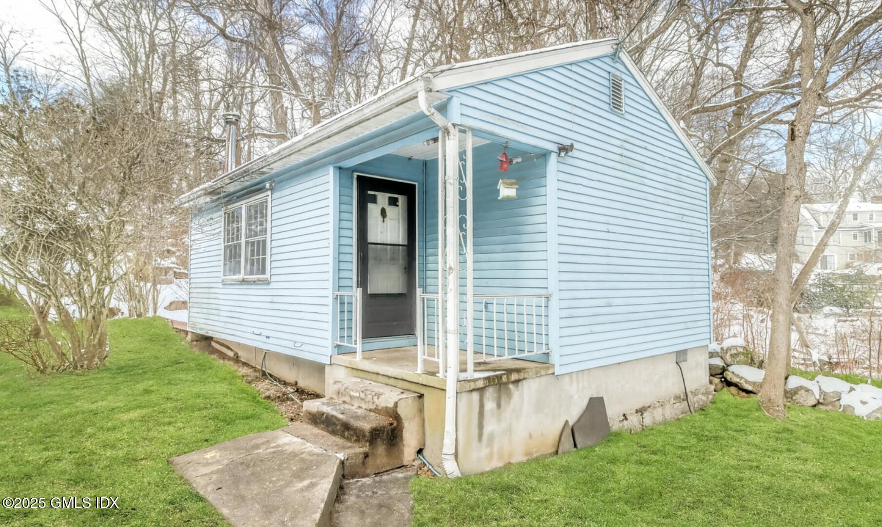 9 Walnut Street Cos Cob, CT 06807 - Photo 10 of 10 a view of a house with a yard