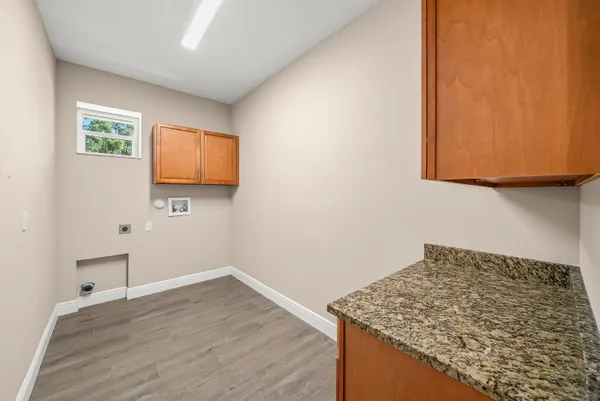 a room with a wooden floor and a sink