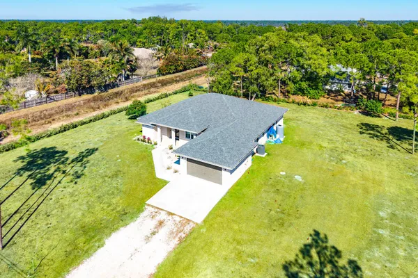 a view of a yard with an outdoor seating