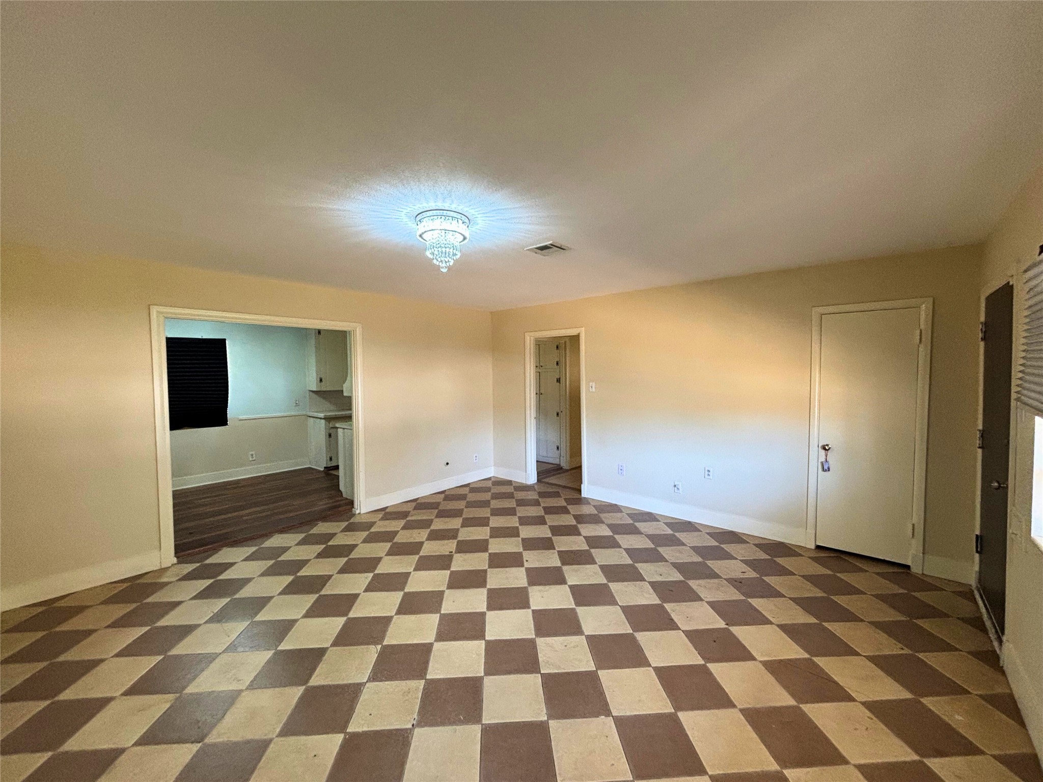 7022 Merriwood Lane Houston, TX 77076 - Photo 3 of 12 a view of a big room with a fireplace and cabinets