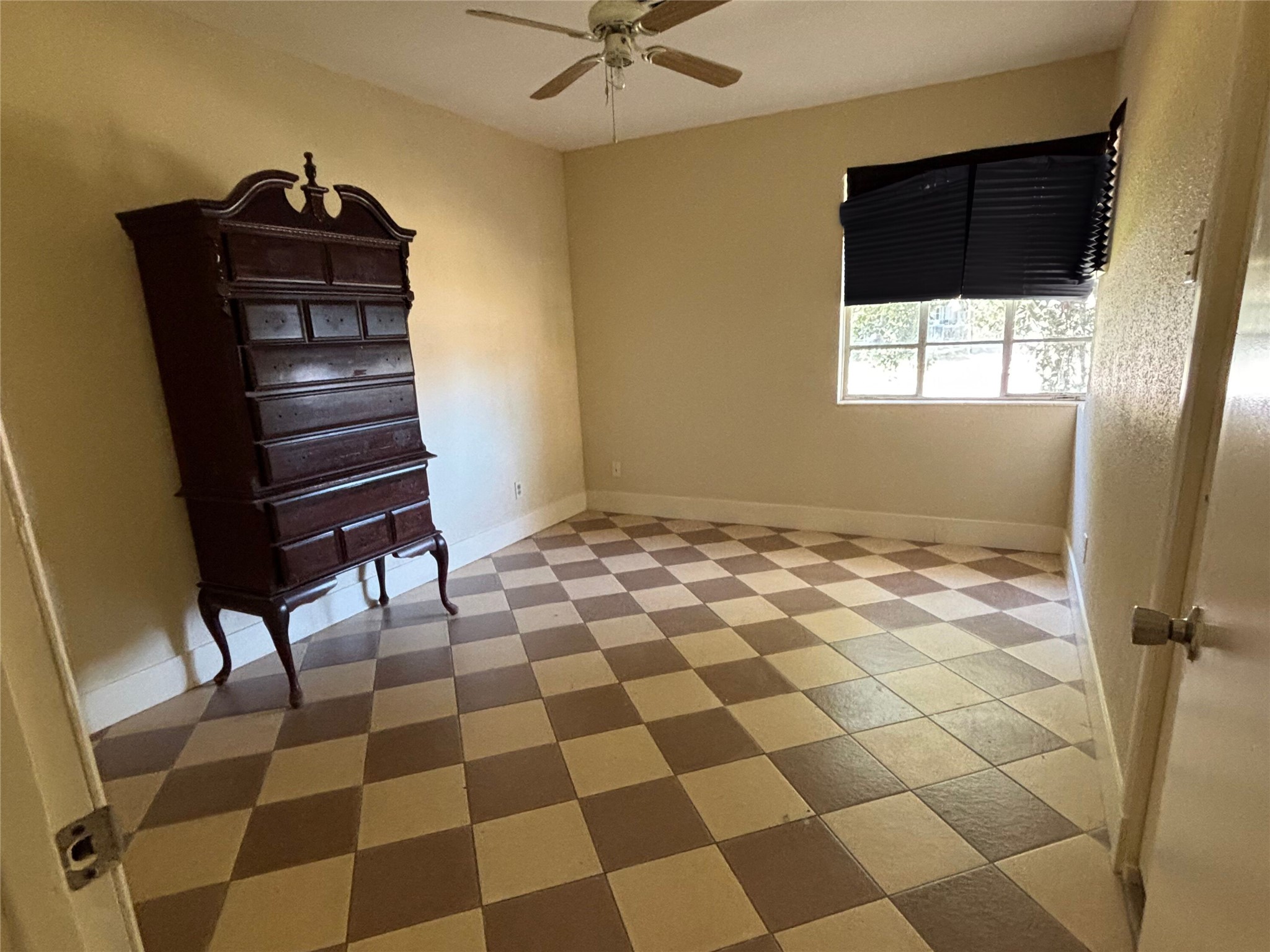 7022 Merriwood Lane Houston, TX 77076 - Photo 8 of 12 a room with a black white checkered floor