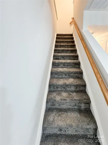 a bathroom with a sink a toilet a mirror and vanity