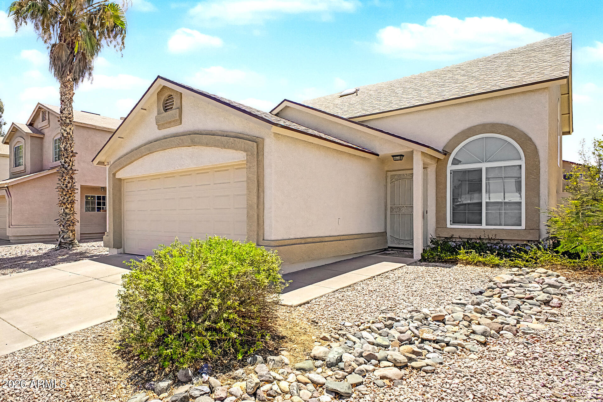 3134 East McKellips Road, Unit 221 Mesa, AZ 85213 - Photo 2 of 29 a front view of a house with a yard