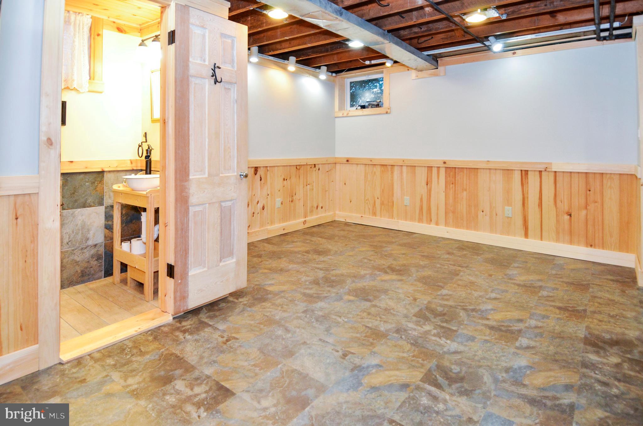 7746 Wynbrook Road Baltimore, MD 21224 - Photo 21 of 32 LOWER LEVEL REC ROOM