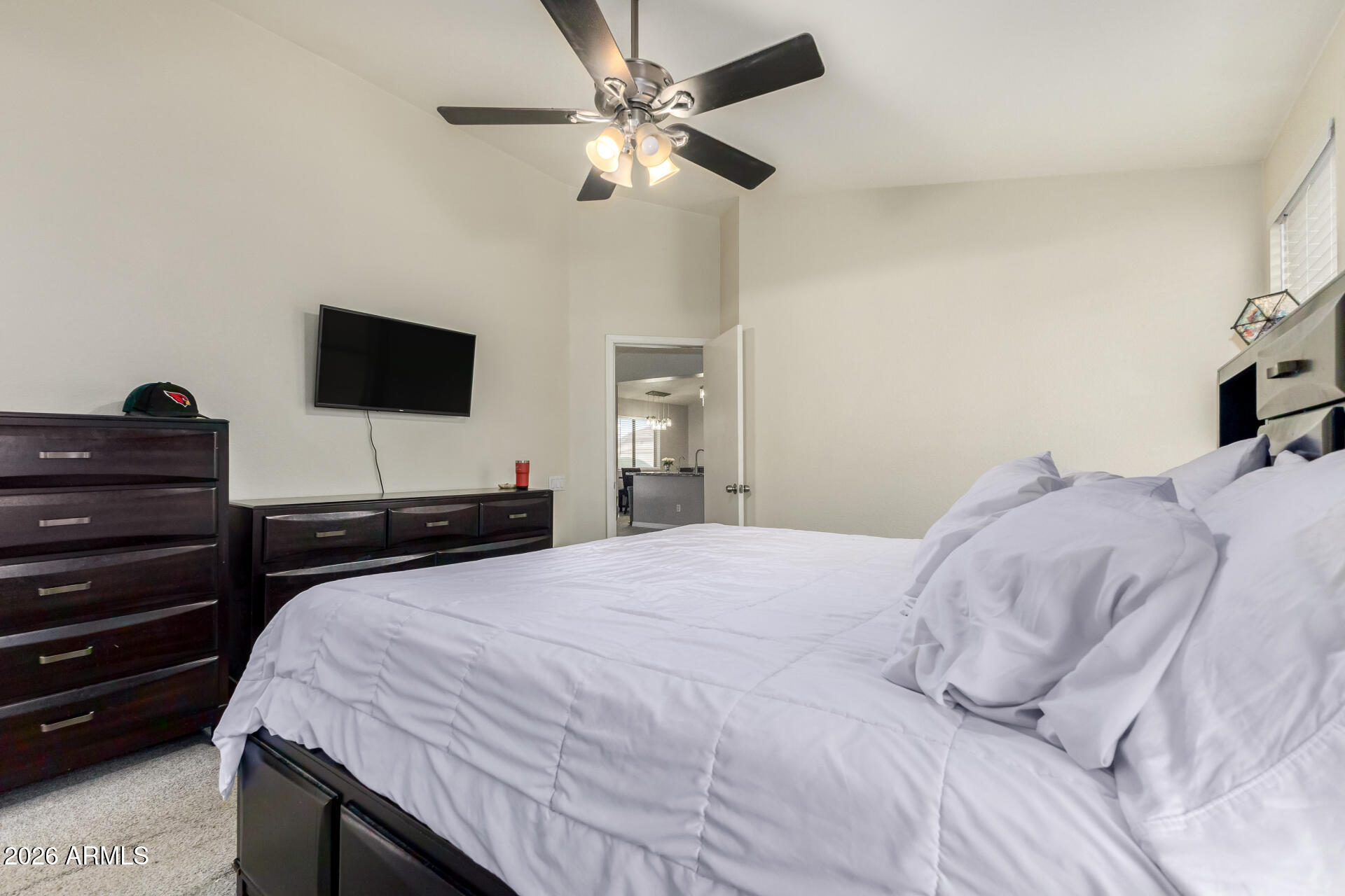 3407 East Escuda Road Phoenix, AZ 85050 - Photo 15 of 32 a bedroom with a bed and a flat screen tv