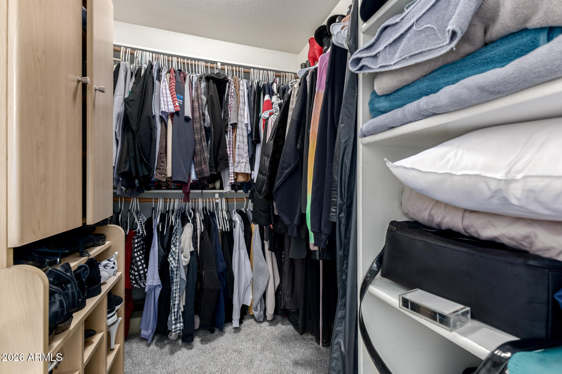 3407 East Escuda Road Phoenix, AZ 85050 - Photo 17 of 32 a view of walk in closet with clothes