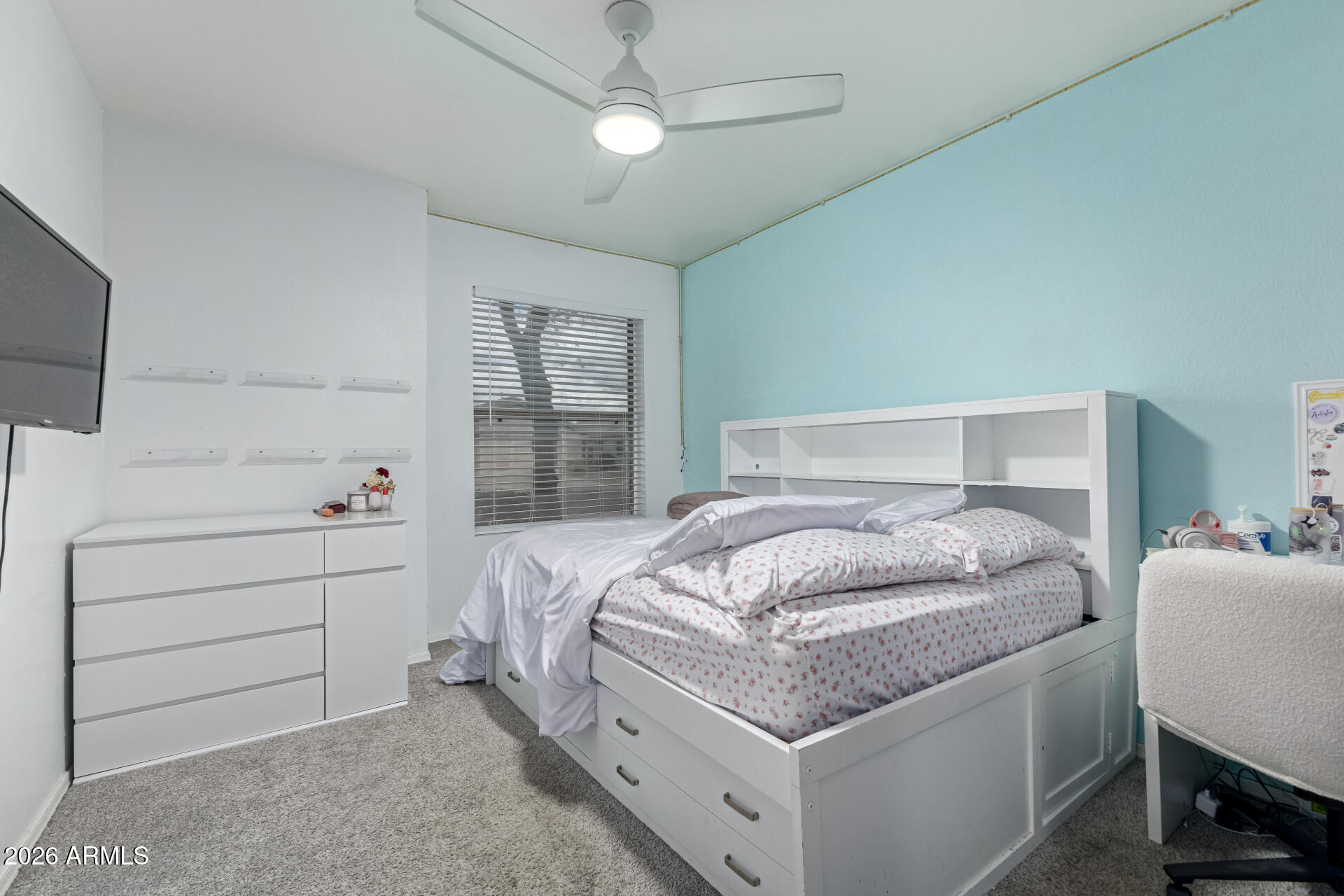 3407 East Escuda Road Phoenix, AZ 85050 - Photo 18 of 32 a bedroom with a bed and a flat tv screen on dresser