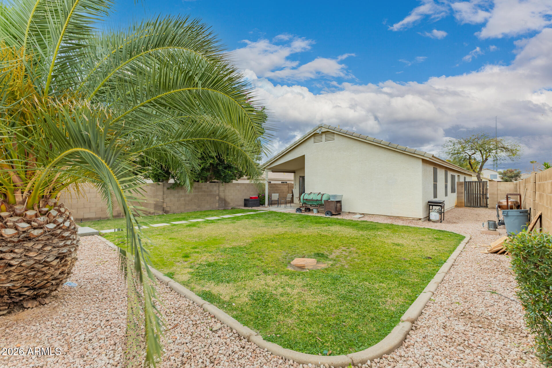 3407 East Escuda Road Phoenix, AZ 85050 - Photo 26 of 32 a view of a house with a backyard