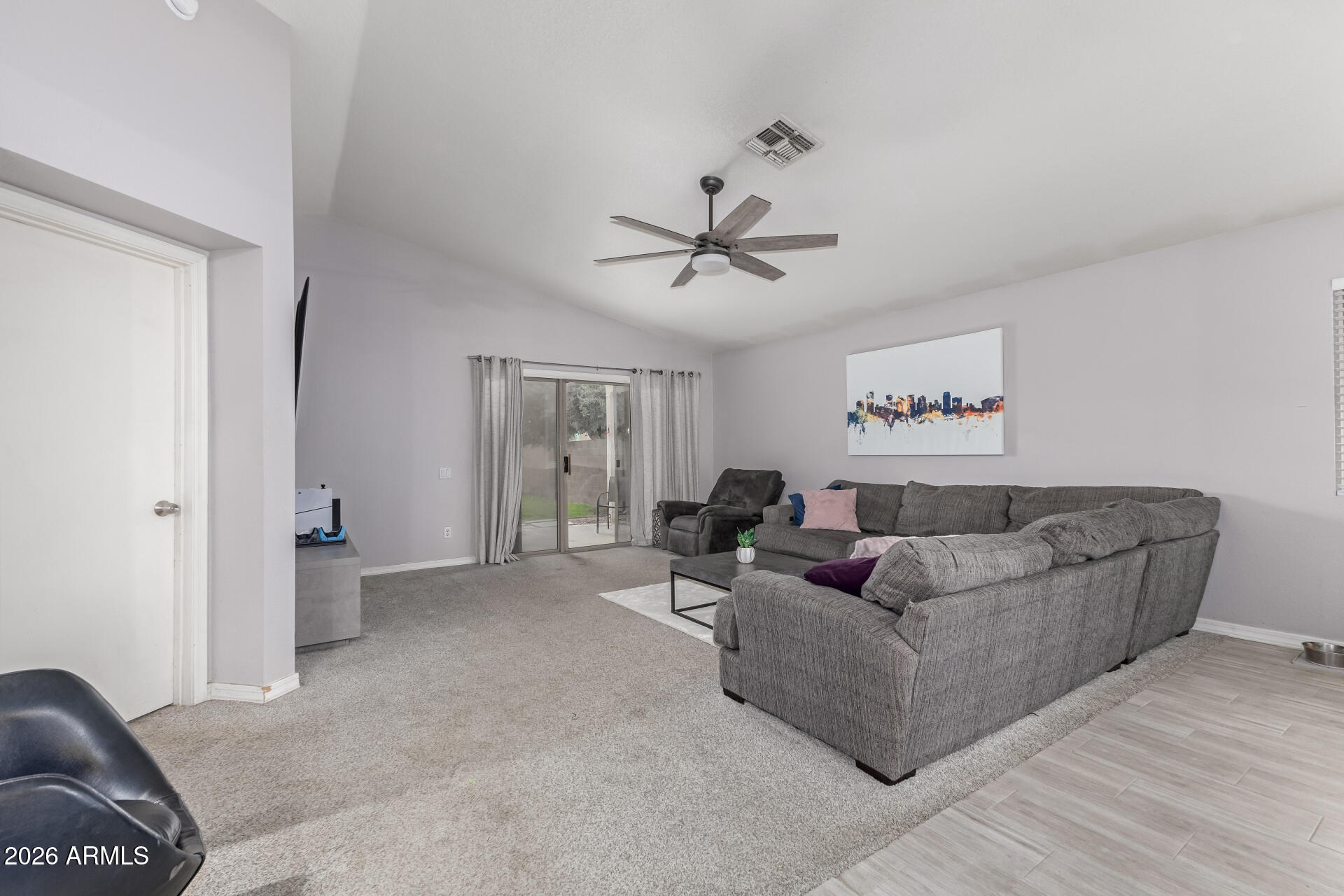 3407 East Escuda Road Phoenix, AZ 85050 - Photo 7 of 32 a living room with furniture and a ceiling fan