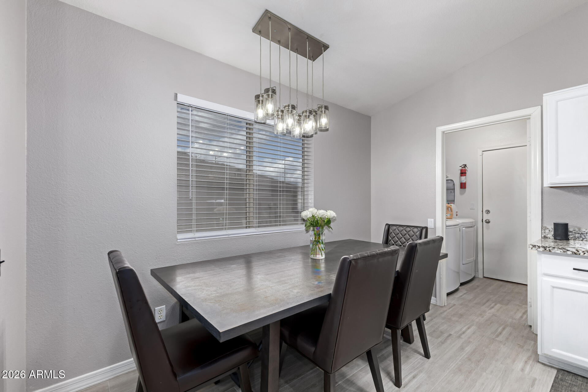 3407 East Escuda Road Phoenix, AZ 85050 - Photo 9 of 32 a view of a dining room with furniture and window