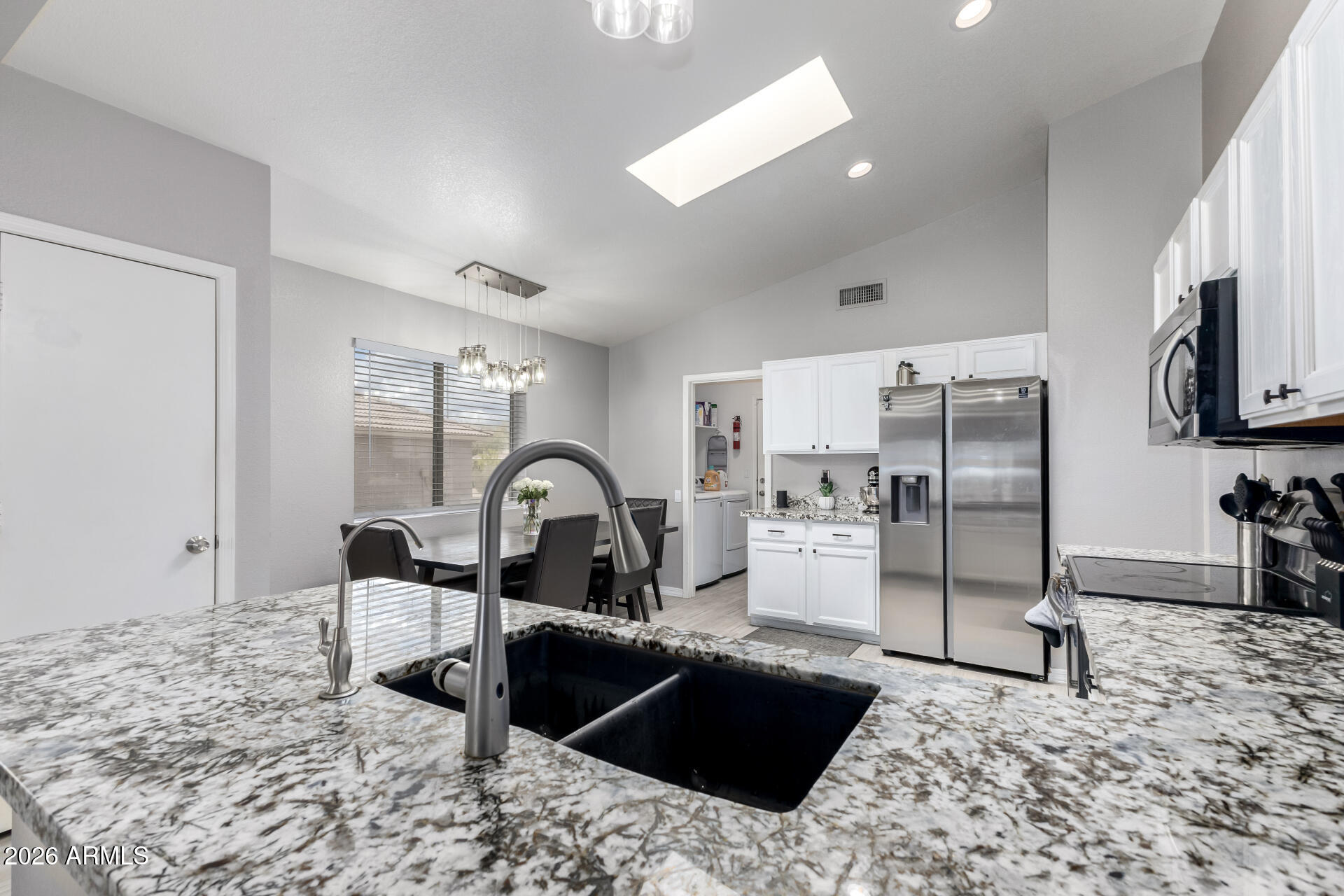 3407 East Escuda Road Phoenix, AZ 85050 - Photo 10 of 32 a kitchen with a refrigerator and a sink