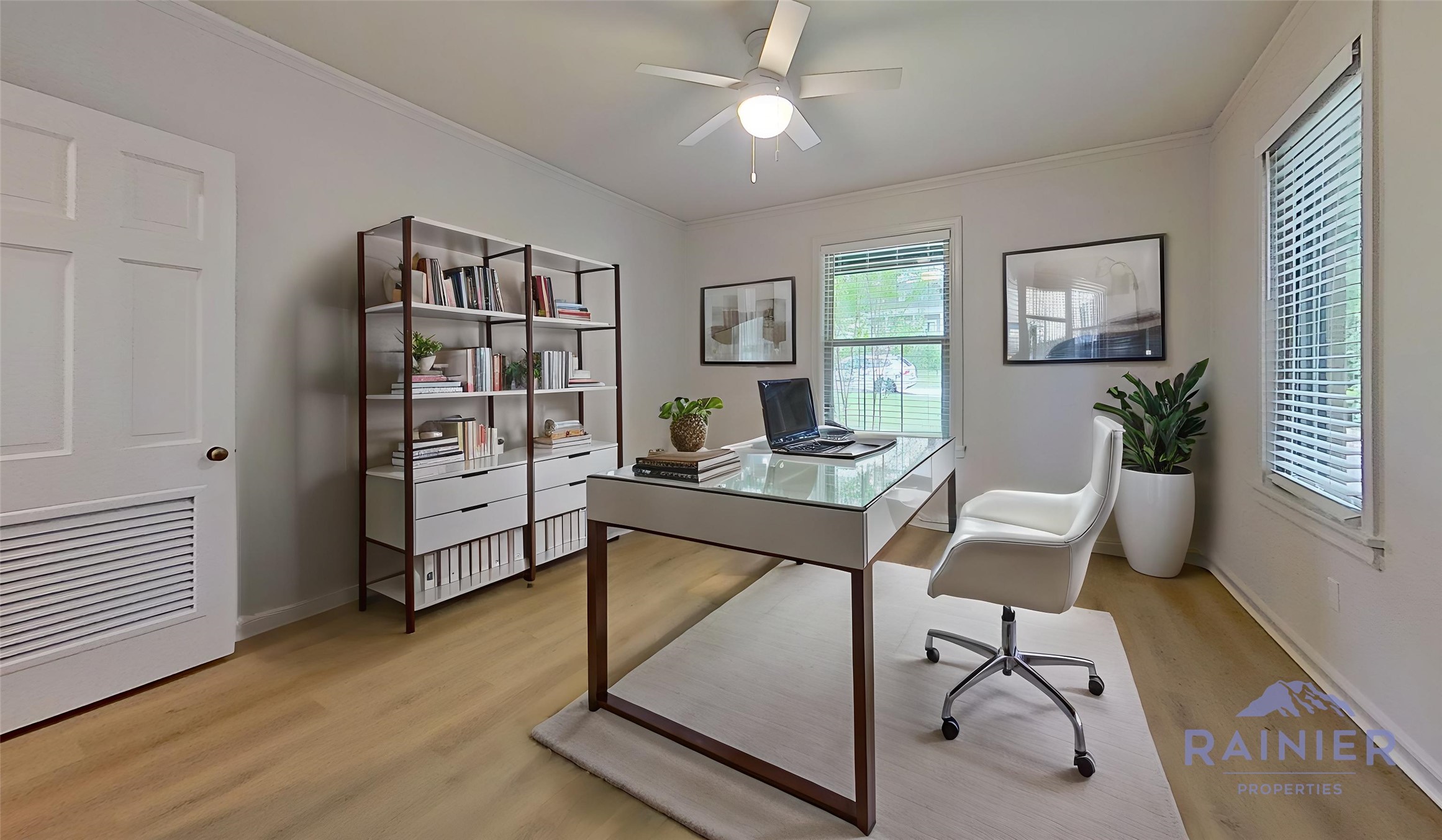 1703 Summit View Place, Unit A Austin, TX 78703 - Photo 3 of 13 Virtually Staged: An inviting home office features sleek flooring and generous natural light for productive workdays.