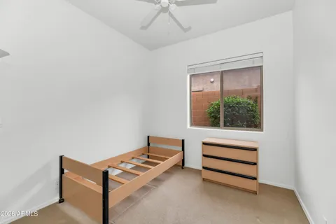 a view of a room with stairs and a ceiling fan
