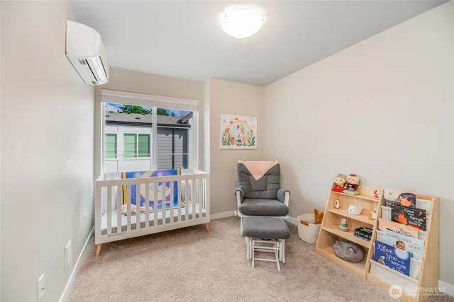 a bedroom with furniture and a book shelf
