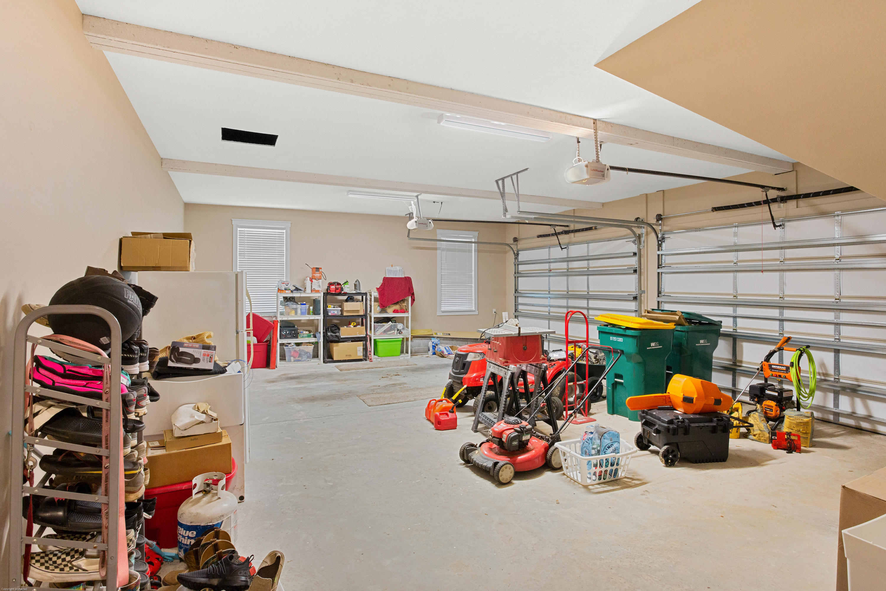 5887 Oak Hill Road Crestview, FL 32536 - Photo 27 of 44 a storage room with lots of clutter and bicycles